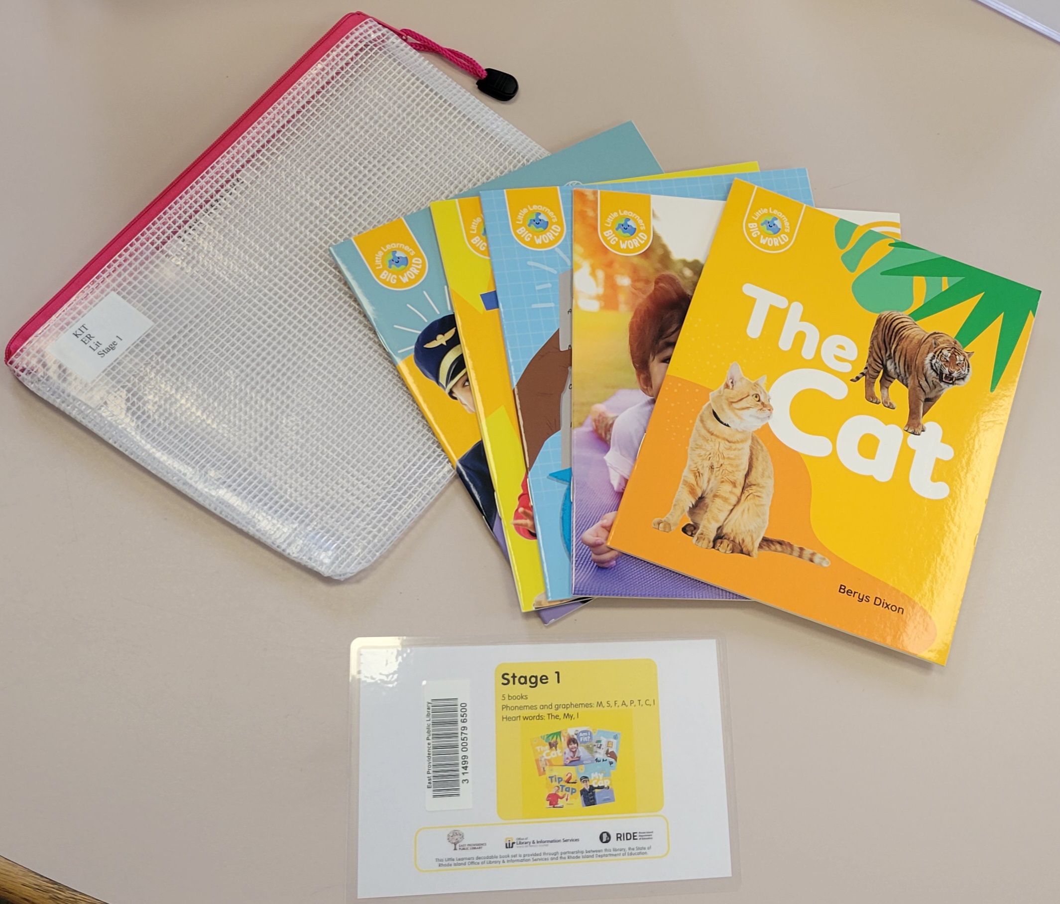 Zipper pouch with 5 books laid out on front of it and a card that says 'Stage 1'