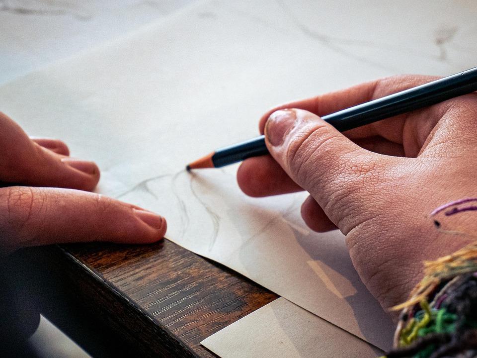 artist sketching photograph